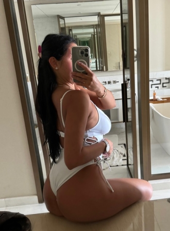 Aylin looks very sexy wearing a white swimsuit with a thonged back 