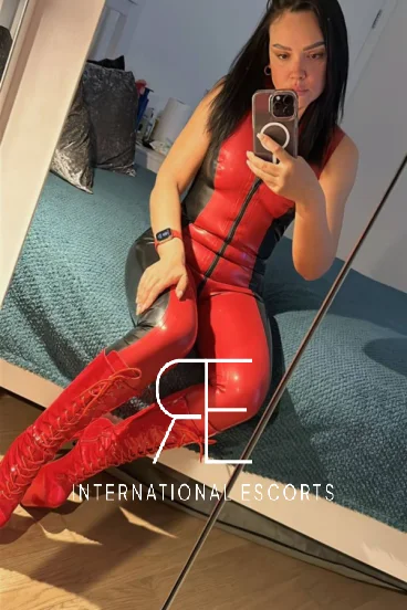 Mistress Julie looks very sexy dressed in red latex 