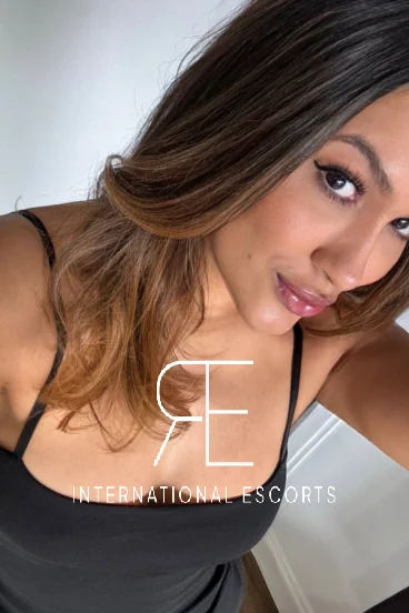 Very beautiful Brazilian escort Latifa took this selfie of her wearing a low cut top 