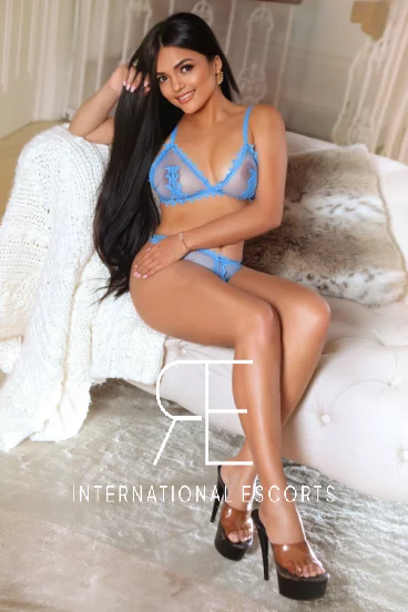 Dulce looks very sexy wearing light blue lingerie 