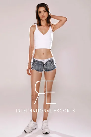 London escort wearing denim shorts 