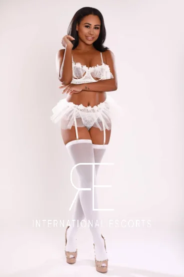 Ebony London escort Astrid wearing white sexy underwear 