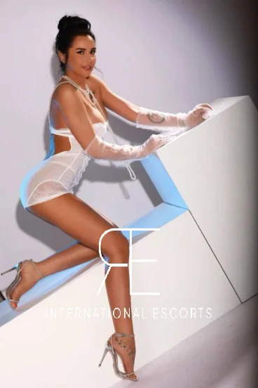 Sexy escort Nina wearing white lingerie 