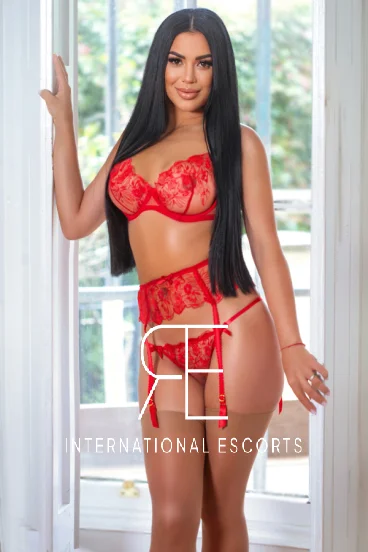 High class Eastern Europe escort dressed in red lace lingerie 