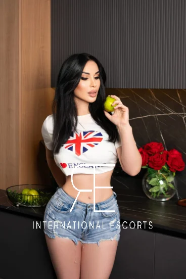 London escort biting an apple 