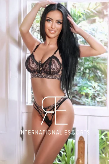 London escort Simone wearing black lingerie 