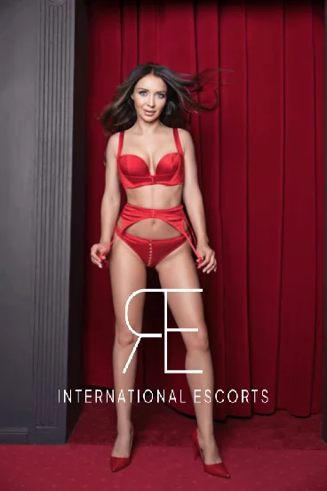 Alexandra looks very sexy wearing red lingerie 