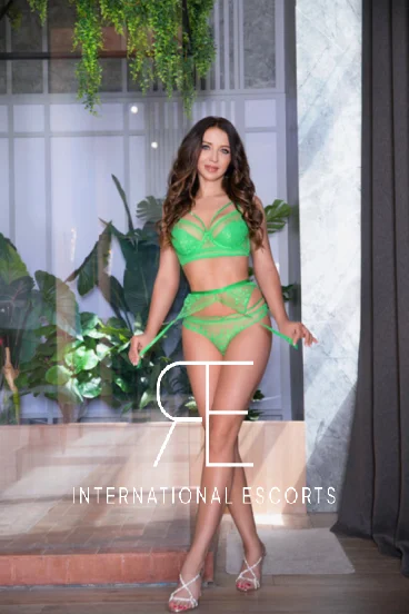 A Russian babe dressed in sexy green underwear and fuck me high heels 