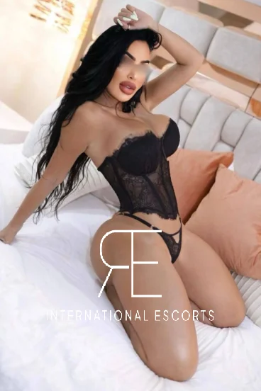 Busty London escort Cece is wearing sexy black lingerie in this photo 