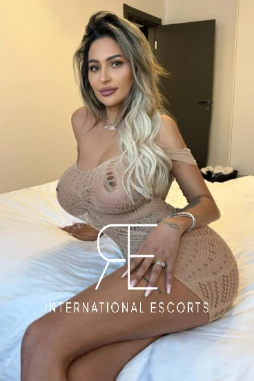 Valeria looks very sexy in this mesh cut away dress that she is wearing 