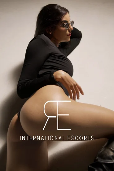 Curvy Brazilian escort Sadie showing off her round arse 