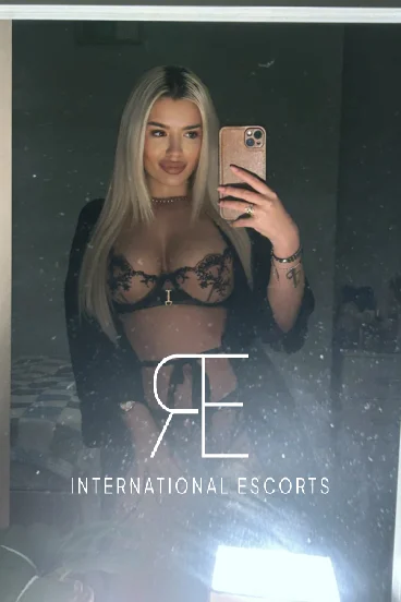 A very sexy blonde lady wearing sexy black lingeire 