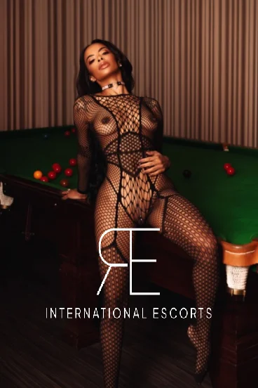 Asha pictured wearing a fishnet body stocking 