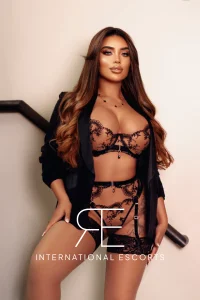 A very sexy London escort named Tornia is pictured wearing black lace lingerie 